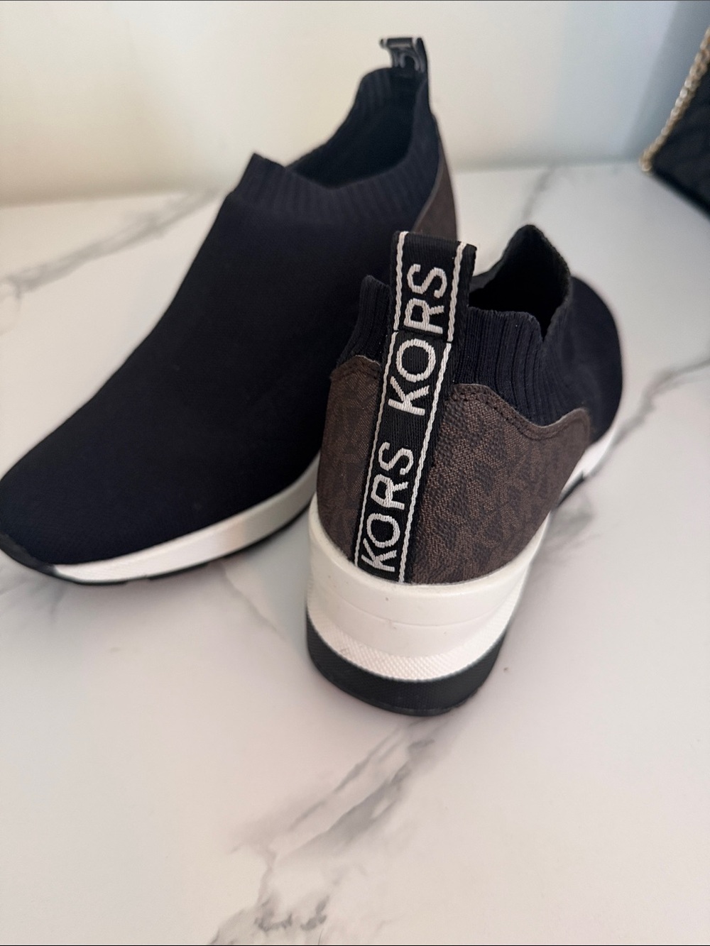 KORS Michael Kors Black Knit Slip-On Wedge Sneakers with Brown Accent